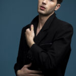 medium-shot-man-posing-with-blue-background